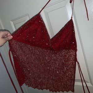Red, sparkle , see through shirt.